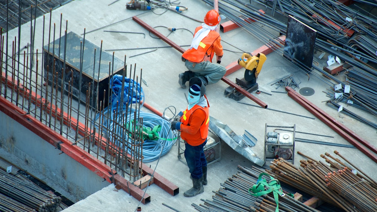 Roofing contractor inspecting a residential roof
