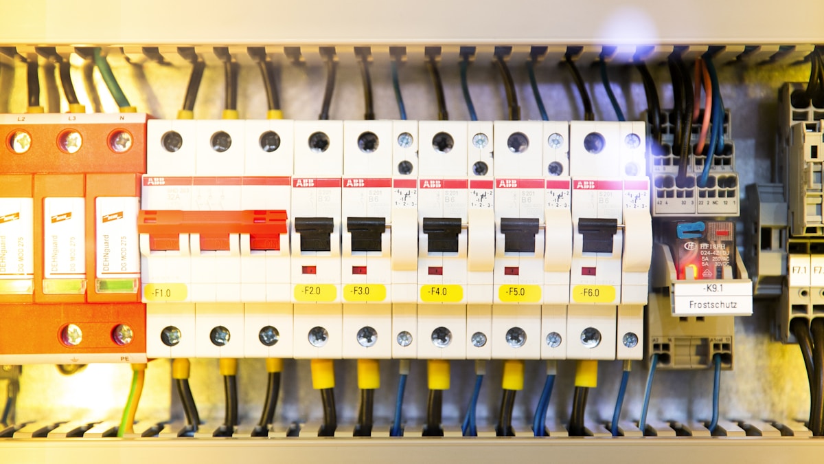 Electrician working on a commercial electrical panel